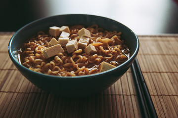 Hot tasty ramen with tofu in bowl home cooking steam Asian food