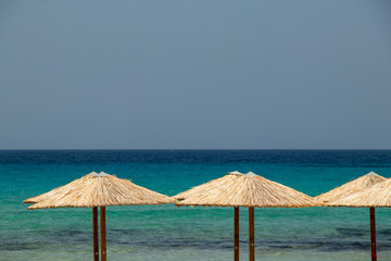 Umbrellas on beach in Milos island
