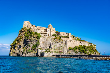 Fototapeta na wymiar Aragonese Castle - Castello Aragonese on a beautiful summer day, Ischia island, Italy