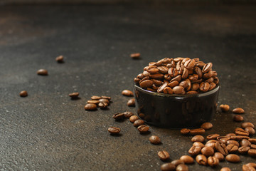 coffee beans (roasted coffee beans) Arabica and Robusta blend. Dark background. Top view . Copy space