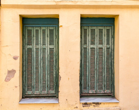 Windows with green wooden shutters