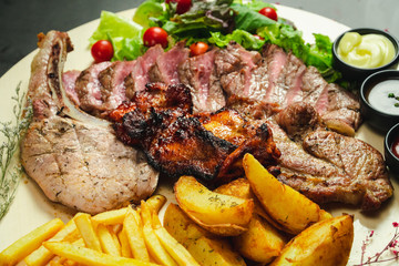 Food shot mix grilled steak with fried and salad