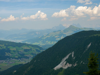 Beautiful alpine landscape with green meadows, alpine cottages and mountain peaks, Alpinolino, Westendorf Tyrol Alps, Austria