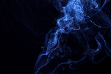 Movement of smoke on black background, blue smoke background, picture on wallpaper, design concept