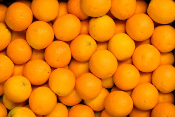 bright orange oranges in a box close-up