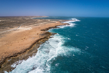 Quobba Blow Holes coast line aerial view of waves during windy weather in Western Australia