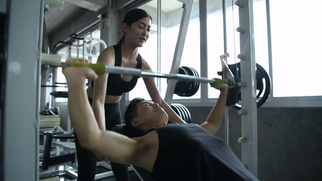 Sports concept. Couples are enjoying sports in fitness.