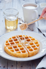 Homemade Waffles with organic honey for breakfast
