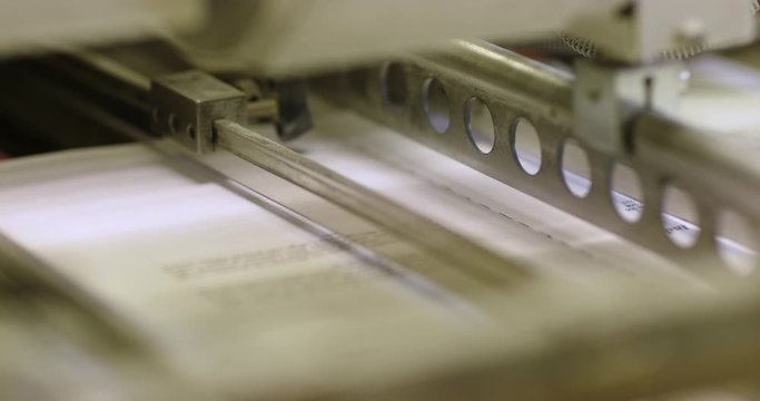 Footage of the printing process of the book.