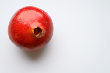 Ripe pomegranate on white background, top view