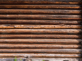 Log wall of rustic house. Wooden texture