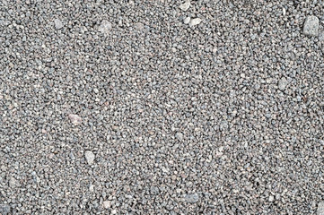 Gravel texture. Fine gray granite stone gravel.