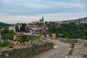 Fototapeta na wymiar Entrance gate of Tsarevets Fortress and Veliko Tarnovo old town at background, Bulgaria
