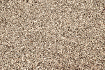 Gravel texture. Fine brown granite stone gravel.