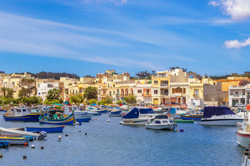 Fototapeta na wymiar View of a seaside promenade in Birzebbuga, Malta