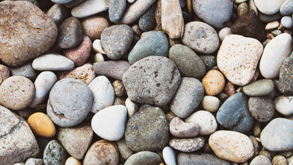 Multiple oval shape of stons. Sea peblles beach. Beautiful nature.