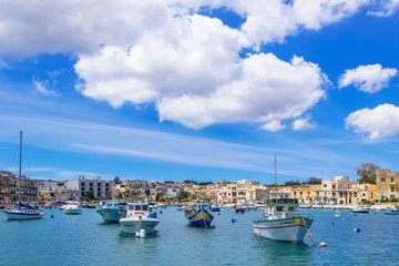 Fototapeta na wymiar View of a seaside promenade in Birzebbuga, Malta