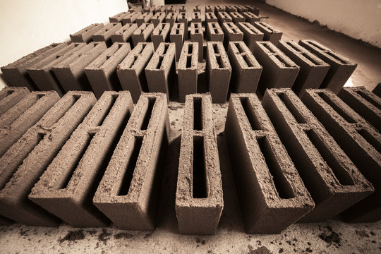 Bricks made from cement dry on the floor