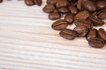 mockup of coffee beans on isolated wooden textured background