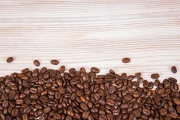 mockup of coffee beans on isolated wooden textured background