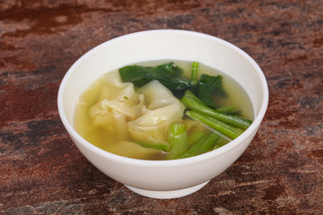 Asian traditional Wonton soup with herbs