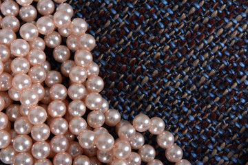 Pearl necklace on the gray background texture
