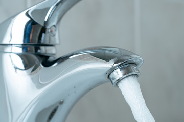 clean water flowing from the tap