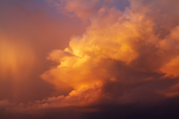 Fototapeta na wymiar Dramatic bright orange yellow and blue colors of sunset sky