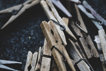 Details with a stack of plastic and wooden clothes pegs