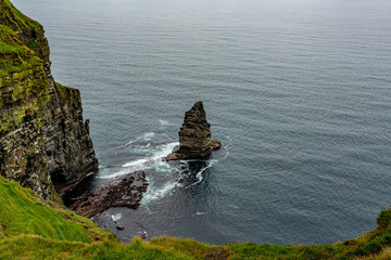 The Branaunmore sea stack in the Cliffs of Moher, geosites and geopark, Wild Atlantic Way, wonderful spring day in county Clare in Ireland