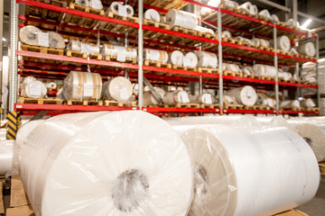 Racks of rolled and packed polyethylene film in storage area