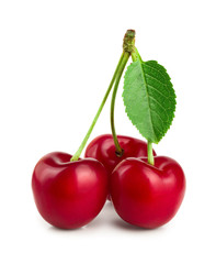 Sweet red cherries with leaves isolated on white background macro