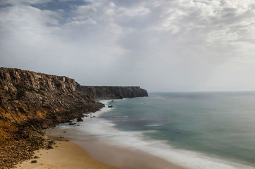 Fototapeta na wymiar Wild and undiscovered beaches and cliffs in the Algarve's West Coast, near Lagos, Portugal. 