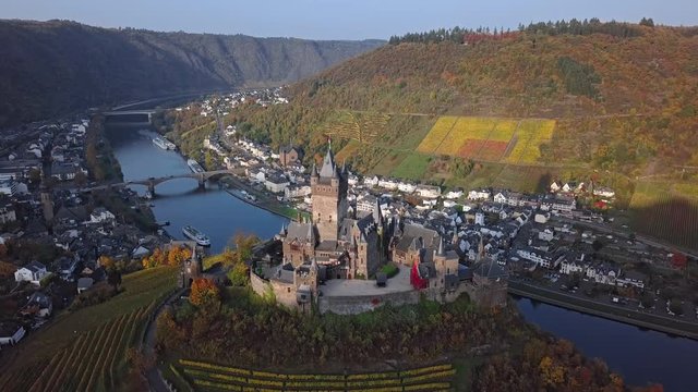 Flight around autumn Cochem castle vineyards, Mosel valley, Germany