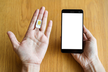 sim card and smart phone on hand, select focus