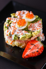 Round salad made of red fish potato and avocado