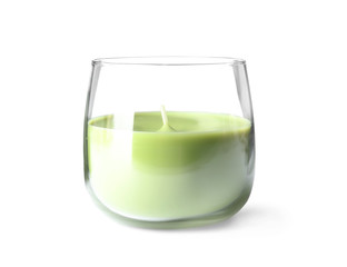 Green wax candle in glass holder isolated on white