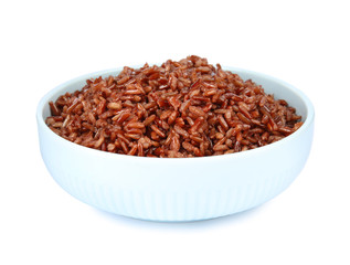 Bowl with delicious cooked brown rice on white background
