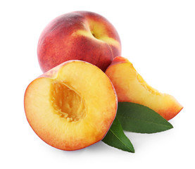 Sweet juicy peaches with leaves on white background