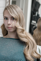 Blonde girl with long hair with wave hairstyle