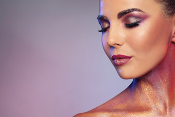 Sexy young woman with glitter makeup on lilac background. Space for text