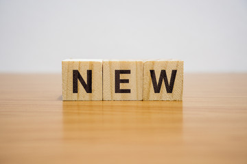 New Word on Wooden Block