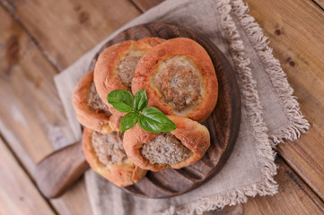 Baking with meat . High-calorie pastries for a delicious snack. Traditional pastries from Russia. Rustic homemade food.
