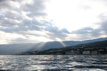 View of the black sea coast in the sunset from the sea. view from ship to shore