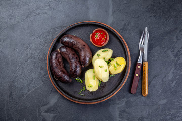 Spanish and Argentine MORCILLA blood sausages with potatoes and chile sauce