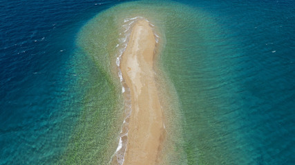 Fototapeta na wymiar Aerial drone photo of tropical exotic island sand bar separating sea in two with turquoise and sapphire breathtaking colours