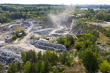 Aerial top view of crushing machinery, conveying crushed granite gravel stone in quarry open pit...