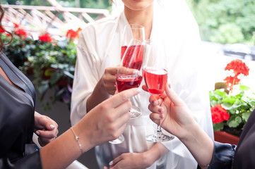 Pink champagne for wedding morning with the bridesmaids 