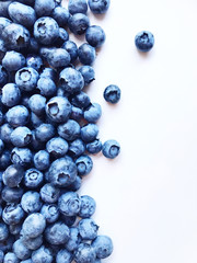 Berry background. Fresh berry blueberries on a white background. Concept of healthy and diet food.