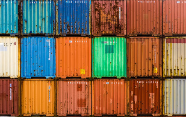 frontal view of Stack of multicolored containers